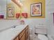 Bright bathroom with marble countertops, modern fixtures, and fresh white tiling at 13288 Elsie Rd, Conifer, CO 80433