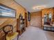 Rustic hallway featuring wood paneling, built-in storage, and vintage decor at 13288 Elsie Rd, Conifer, CO 80433