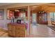 Hallway view into kitchen, featuring cabinetry and appliances at 13288 Elsie Rd, Conifer, CO 80433