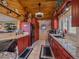 Efficient kitchen design featuring granite countertops, sleek appliances, and ample cabinet space for convenient storage at 13288 Elsie Rd, Conifer, CO 80433
