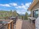 Spacious deck with outdoor furniture, offering scenic mountain views at 13288 Elsie Rd, Conifer, CO 80433