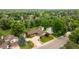 An aerial view showcases the property's expansive lot, mature trees, and neighborhood setting at 5292 W Fair Dr, Littleton, CO 80123