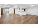 Finished basement featuring wood-look flooring, a bar, and ample space for entertaining at 5292 W Fair Dr, Littleton, CO 80123