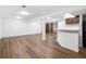Spacious finished basement with wood flooring and a bar area, perfect for entertaining at 5292 W Fair Dr, Littleton, CO 80123
