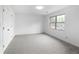 Neutral bedroom offers natural light, neutral carpet, and ample closet space at 5292 W Fair Dr, Littleton, CO 80123