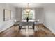 Elegant dining room with contemporary lighting, sleek chairs, and a spacious table at 5292 W Fair Dr, Littleton, CO 80123