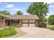 Charming home with a two car garage and well manicured lawn at 5292 W Fair Dr, Littleton, CO 80123