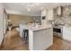 Beautiful kitchen featuring a large center island, modern appliances, and ample counter space at 5292 W Fair Dr, Littleton, CO 80123