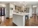 Well-lit kitchen boasting a large island, contemporary cabinets, and modern fixtures at 5292 W Fair Dr, Littleton, CO 80123