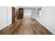 Open floor plan featuring wood-look flooring, natural light, and transitions to adjacent rooms at 5292 W Fair Dr, Littleton, CO 80123