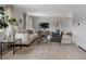 Bright living room featuring neutral paint, plush carpet, and tastefully curated decor at 5292 W Fair Dr, Littleton, CO 80123
