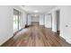 Spacious living room showcases wood-look floors and access to outdoor space through sliding doors at 5292 W Fair Dr, Littleton, CO 80123