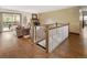 Bright living space with hardwood floors, a fireplace, and access to an outdoor deck at 5292 W Fair Dr, Littleton, CO 80123