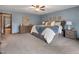 Large main bedroom with an ensuite bathroom and well-lit space at 5292 W Fair Dr, Littleton, CO 80123