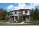 Modern two-story home featuring stone accents and a well-maintained front yard at 17005 E Alameda Pkwy, Aurora, CO 80017