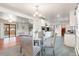 Open floor plan combining dining and kitchen areas, featuring modern appliances and seamless integration at 591 Nome St, Aurora, CO 80010