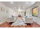 Bright living room offers hardwood floors, recessed lighting, and comfortable seating for relaxation at 591 Nome St, Aurora, CO 80010