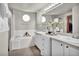 Double vanity bathroom with soaking tub and stylish finishes at 1607 Rosedale St, Castle Rock, CO 80104