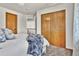 Bedroom with double closet and window at 1607 Rosedale St, Castle Rock, CO 80104