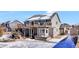 Two-story house with large deck and snowy yard at 1607 Rosedale St, Castle Rock, CO 80104