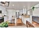 Modern kitchen with white cabinets, granite counters, and stainless steel appliances at 1607 Rosedale St, Castle Rock, CO 80104