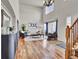 Bright living room with hardwood floors, high ceilings, and lots of natural light at 1607 Rosedale St, Castle Rock, CO 80104