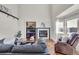 Living room featuring a cozy fireplace, built-in shelving, and comfortable seating at 1607 Rosedale St, Castle Rock, CO 80104