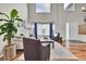 Comfortable living room with hardwood floors, high ceilings, and large windows at 1607 Rosedale St, Castle Rock, CO 80104