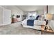 Main bedroom with ample space, large bed, and private deck access at 1607 Rosedale St, Castle Rock, CO 80104