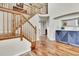 Elegant staircase with wooden railing leading to the upper level at 1607 Rosedale St, Castle Rock, CO 80104