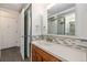 Well-maintained bathroom with updated vanity, mirror, and shower at 888 N Logan St # 2E, Denver, CO 80203