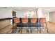 Modern kitchen island with barstool seating and stainless steel appliances, ideal for entertaining guests at 888 N Logan St # 2E, Denver, CO 80203