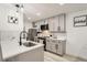 Modern kitchen with gray cabinets, white quartz countertops and black hardware at 1825 Kendall St # 101, Lakewood, CO 80214