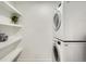 Stackable washer and dryer, plus shelving for storage at 1825 Kendall St # 101, Lakewood, CO 80214