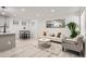 Bright living room with white couch and modern coffee table at 1825 Kendall St # 101, Lakewood, CO 80214