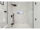 Modern shower with marble tile and niche at 1825 Kendall St # 101, Lakewood, CO 80214