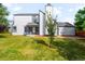 Charming two-story home with green lawn and attractive curb appeal on a sunny day at 9654 W Elmhurst Pl, Littleton, CO 80128