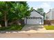 Spacious two car garage with ample parking and attractive landscaping at 9654 W Elmhurst Pl, Littleton, CO 80128