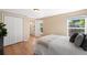 Sunlit main bedroom with hardwood floors, a large closet, and ample natural light at 9654 W Elmhurst Pl, Littleton, CO 80128