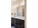 Bright bathroom with double vanity, stylish cabinetry, and a large mirror to enhance the space at 15546 W 64Th Loop # C, Arvada, CO 80007