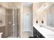 Beautiful bathroom featuring a glass enclosed shower with tiled accents and modern vanity at 15546 W 64Th Loop # C, Arvada, CO 80007