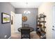 Cozy dining area features a round table with seating and a stylish shelving unit with bar essentials at 15546 W 64Th Loop # C, Arvada, CO 80007