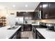 Well-equipped kitchen with stainless steel appliances, quartz countertops, and stylish backsplash at 15546 W 64Th Loop # C, Arvada, CO 80007