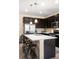 Spacious kitchen with stainless appliances, granite countertops, and island seating at 15546 W 64Th Loop # C, Arvada, CO 80007