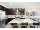 Modern kitchen with a large island, stainless steel appliances, and open layout at 15546 W 64Th Loop # C, Arvada, CO 80007