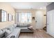 Inviting living room with a comfortable sofa and a view of the neighborhood at 15546 W 64Th Loop # C, Arvada, CO 80007