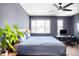 Spacious main bedroom includes a work area and large windows providing ample natural light at 15546 W 64Th Loop # C, Arvada, CO 80007