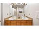 Double vanity bathroom with granite countertops and wood cabinets at 1827 N Grant St # 1000, Denver, CO 80203