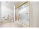 Elegant bathroom with a jacuzzi tub and marble tile surround at 1827 N Grant St # 1000, Denver, CO 80203