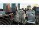 An aerial view showcases Denver's skyline with various architectural styles, reflecting a dynamic urban environment at 1827 N Grant St # 1000, Denver, CO 80203